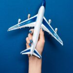Maybe You Heard The News About The Airline Refunds! 14 cropped view of woman holding model of plane on bl 2023 11 27 05 00 30 utc min