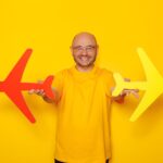 Limited-Time Southwest Deal: Fly 2-for-1 All Year with This Credit Card Offer 15 man holding cardboard airplanes 2023 11 27 04 58 17 utc min