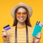 Out with the Gold, In with the Delta Reserve! 17 young smiling female tourist holding credit card a 2024 10 17 10 00 00 utc min