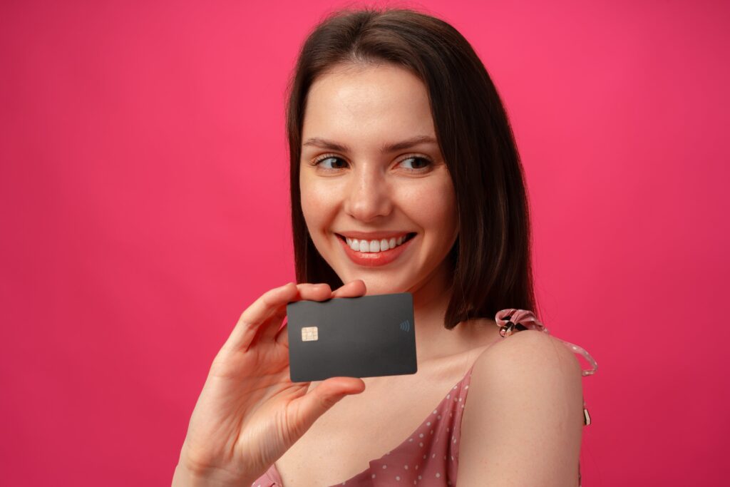 attractive smiling young woman holding black credi 2023 11 27 05 31 58 utc min